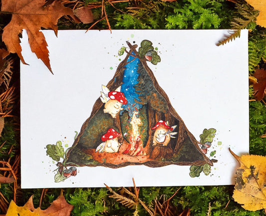 high quality art print placed on an autumnal forest floor, showing three toadstool mushroom fairies around a glowing campfire within a dark forest
the scene is framed within a triangle of vines and branches with acorns and leaves at each point