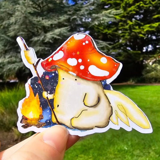 holographic vinyl sticker of a fly agaric toadstool mushroom fairy toasting a mushroom on a stick over a campfire in front of a starry night sky