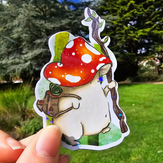 holographic vinyl sticker of a fly agaric toadstool mushroom walking in a forest with a wooden staff, and brown rucksack