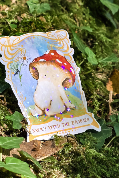 a holographic vinyl sticker with away with the fairies written on it underneath artwork of a toadstool mushroom meeting a fairy who is offering it a daisy