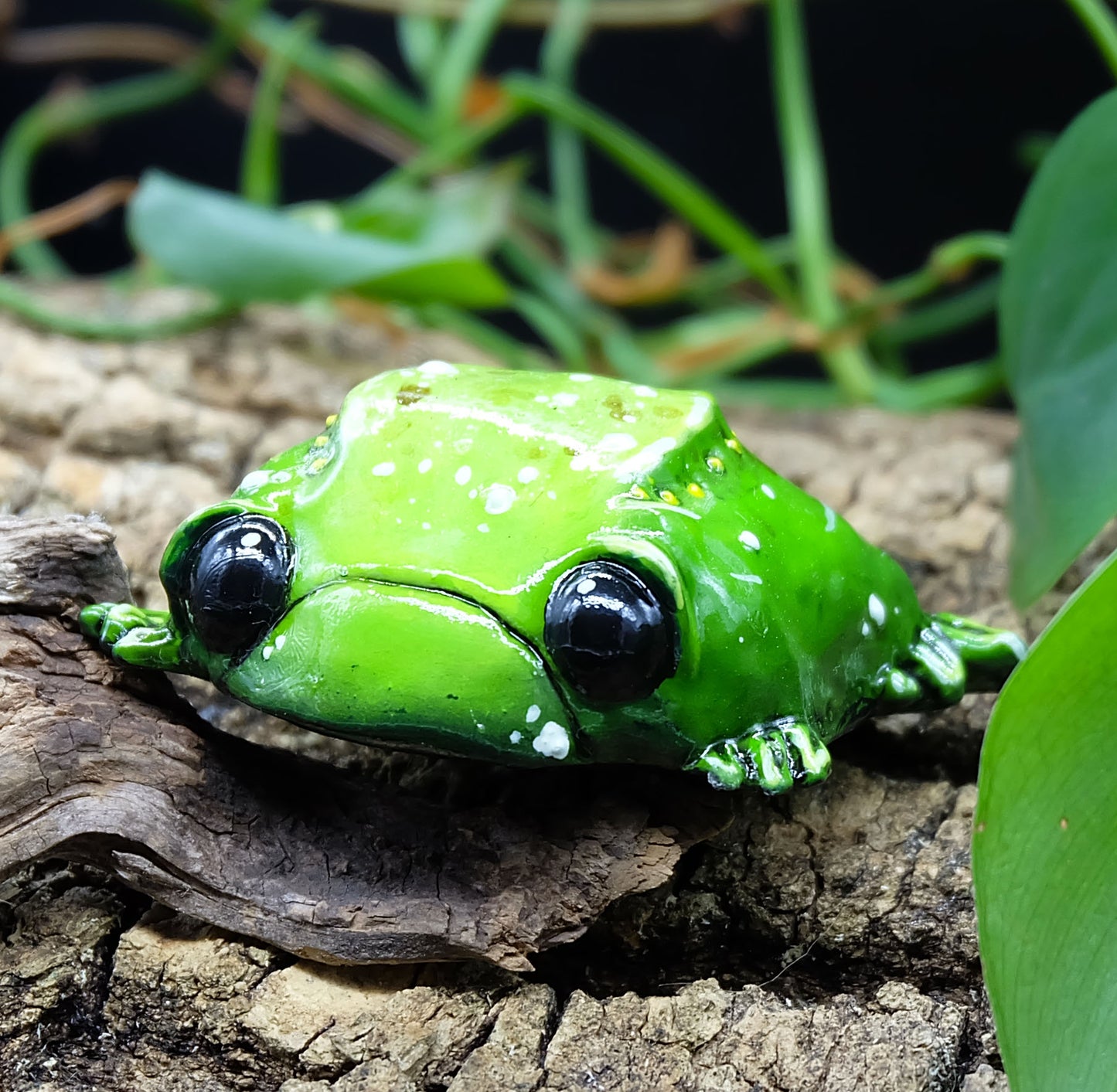 collectible figurine, sculpture of a sad toad / sad frog