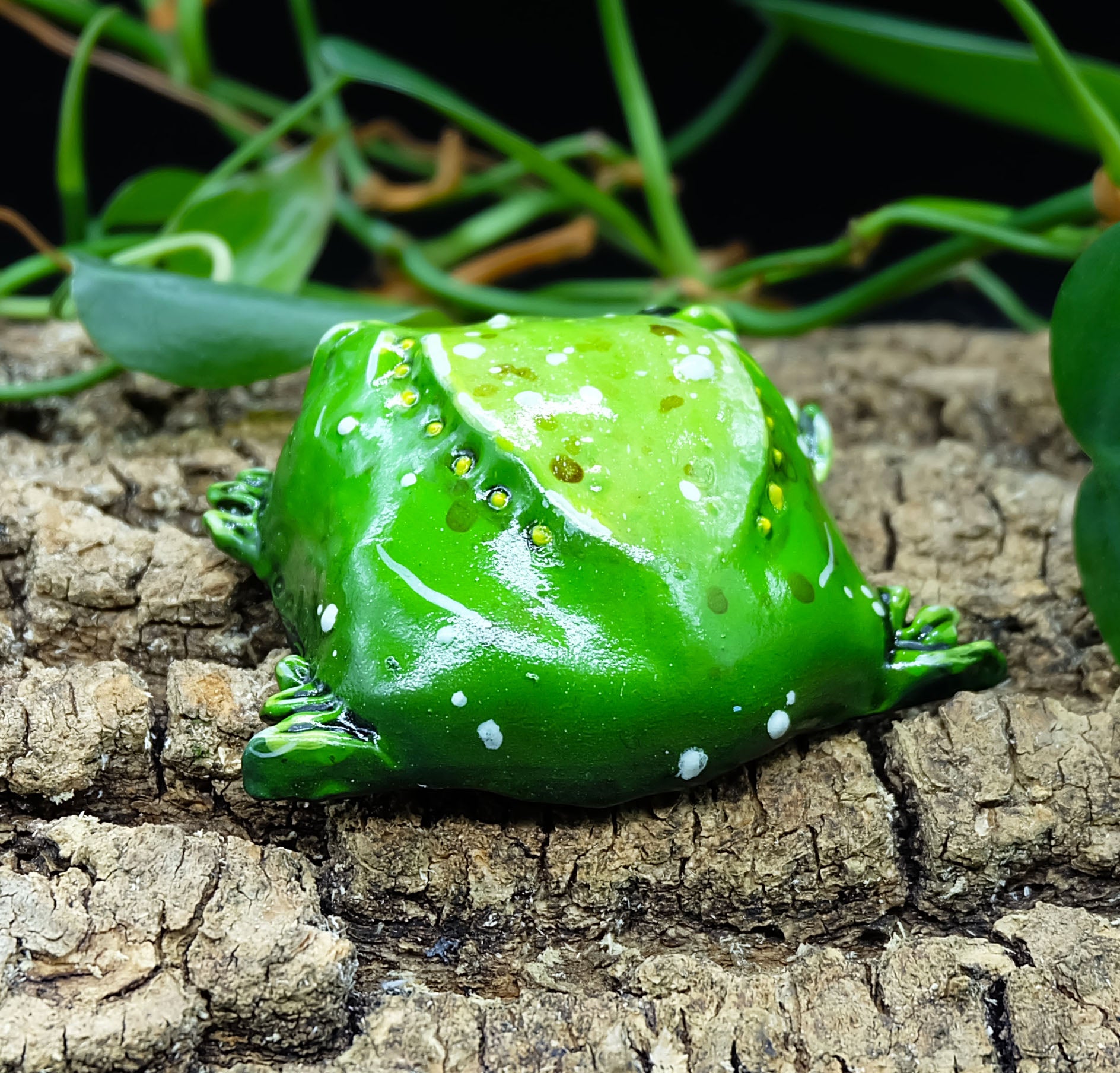 collectible figurine, sculpture of a sad toad / sad frog