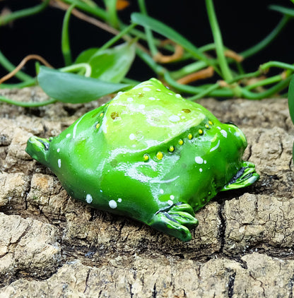 collectible figurine, sculpture of a sad toad / sad frog