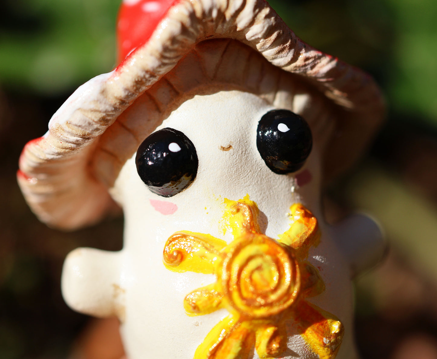 the photo shows alba, the light bringer, who is a fly agaric mushroom. she has a golden sunshine on her soft belly, big cute black eyes, a red and white spotted cap, and she stands with her arms outspread in a loving stance. 