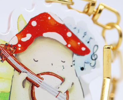 "The Bard" Mushie playing his banjo - glitter Keyring
