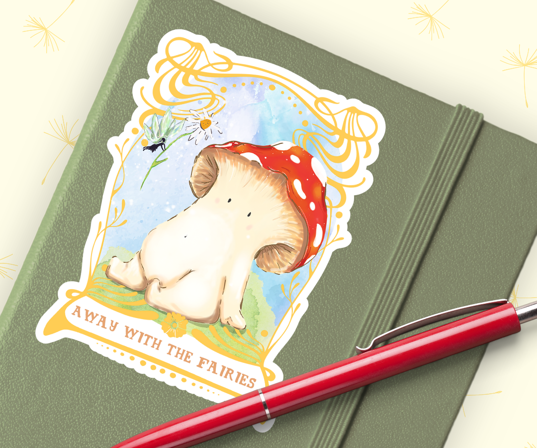 Image shows sticker of toadstool mushroom seated on a bed of mossy grass, they are looking up at a fairy who is handing them a daisy from above. The artwork is framed by an ornate gold art nouveau style frame. the sticker is stuck on the front of a sage green journal. with a red pen placed underneath the bottom of the sticker